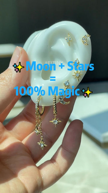 Gold Celestial Moon and Star Earrings on an Ear Display