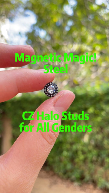 Black Steel CZ Halo Stud Held Between Fingers