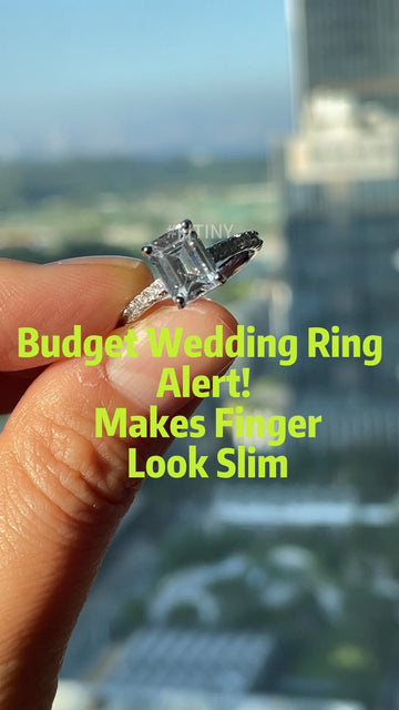 Emerald Cut Moissanite Ring Held at an Angle