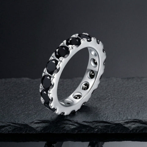 Black moissanite eternity stack ring in S925 sterling silver on dark slate
