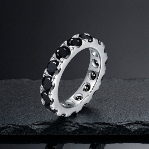 Black moissanite eternity stack ring in S925 sterling silver on dark slate